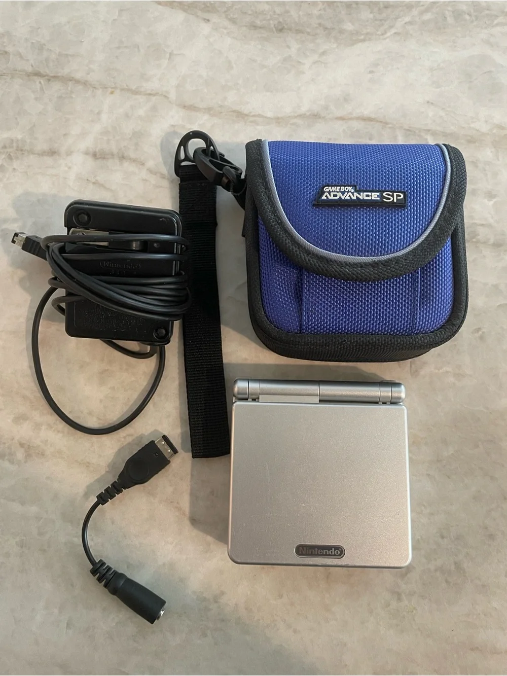 Silver Game Boy Advance SP with Blue Carry Pouch, Charger, Headphone Dongle